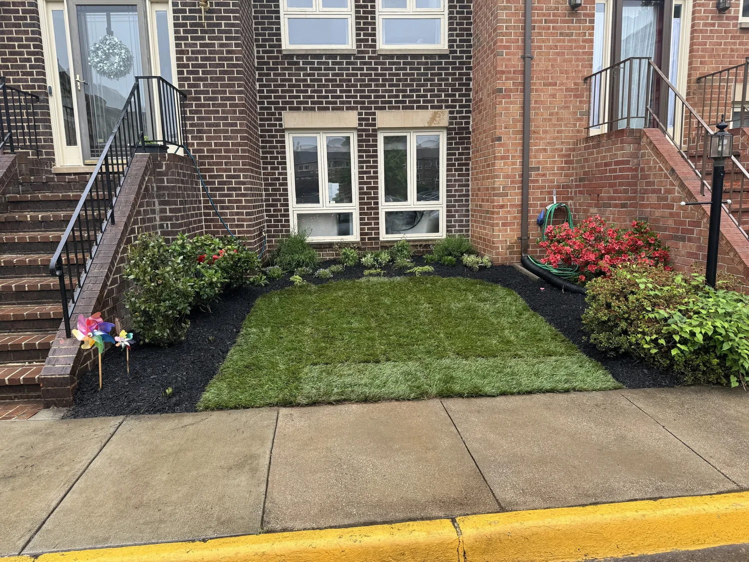 Stone patio and walkway landscaping work.